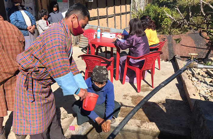   Safety first: Villagers wash hands before availing the services  